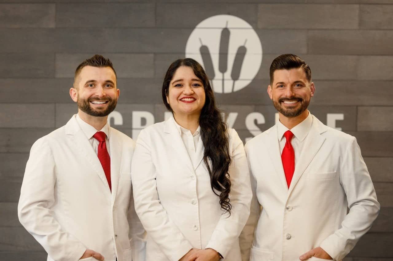 your doctors at Creekside Dental posing for the camera