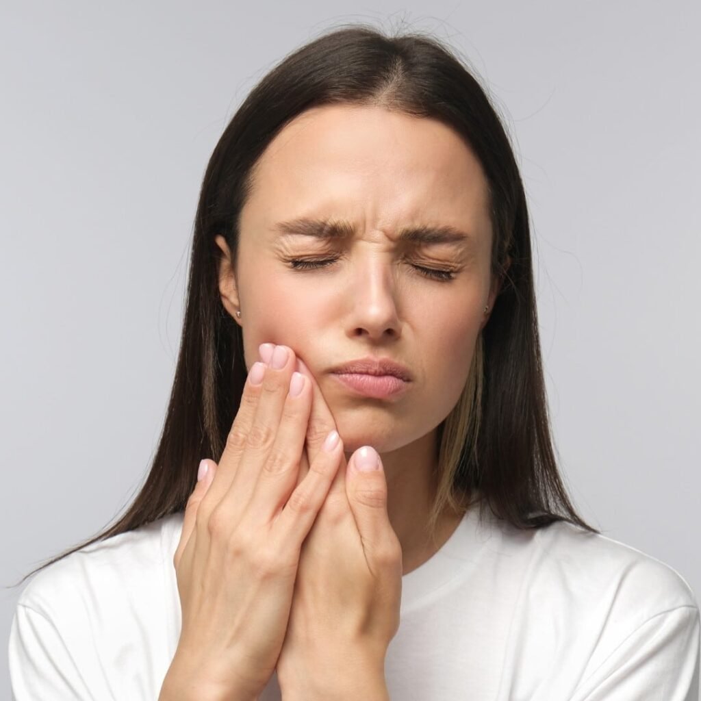 woman hurting from tooth decay Creekside Dental