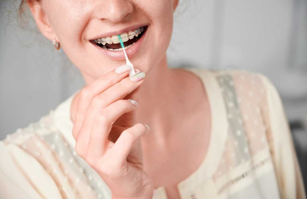 flossing with precision oral hygiene braces care Creekside Dental