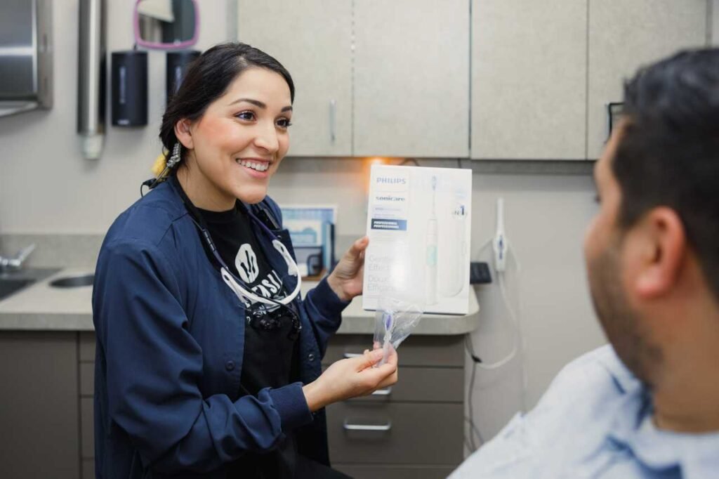 our staff showing patient about Creekside Dental services
