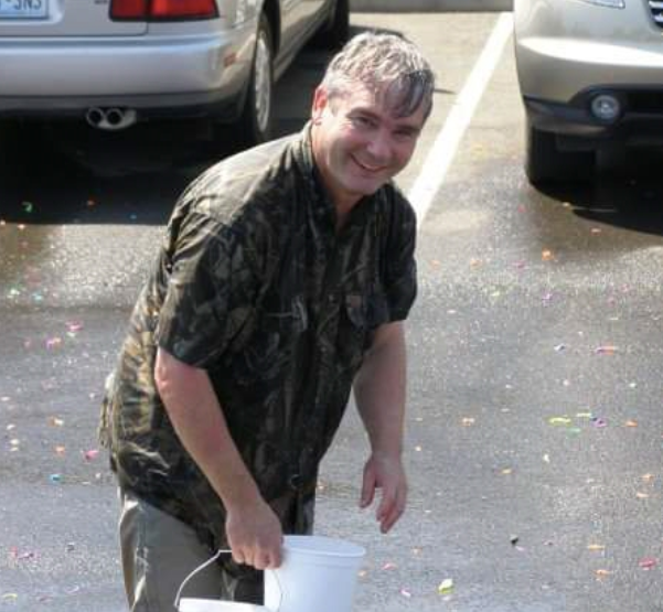 Doctor having fun with water Creekside Dental